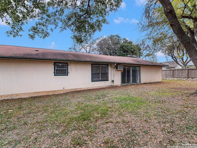 back of property featuring a wall mounted air conditioner