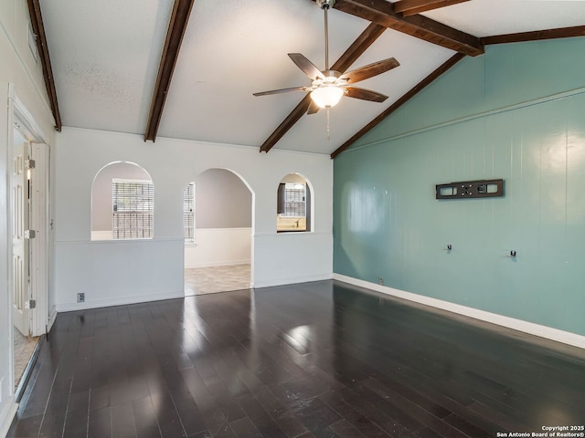 spare room featuring a textured ceiling, lofted ceiling with beams, hardwood / wood-style flooring, and ceiling fan