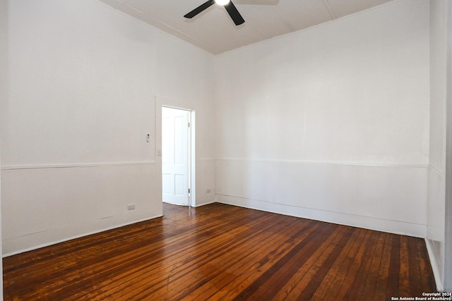 unfurnished room with ceiling fan and dark hardwood / wood-style flooring