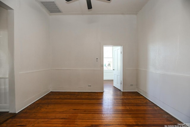 unfurnished room featuring ceiling fan and dark wood-type flooring