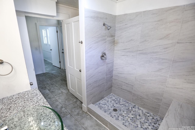 bathroom with a tile shower