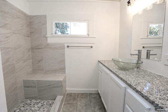 bathroom with tile patterned flooring and vanity