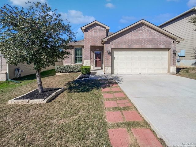 view of front facade featuring a garage and a front yard