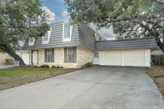 front of property with a garage