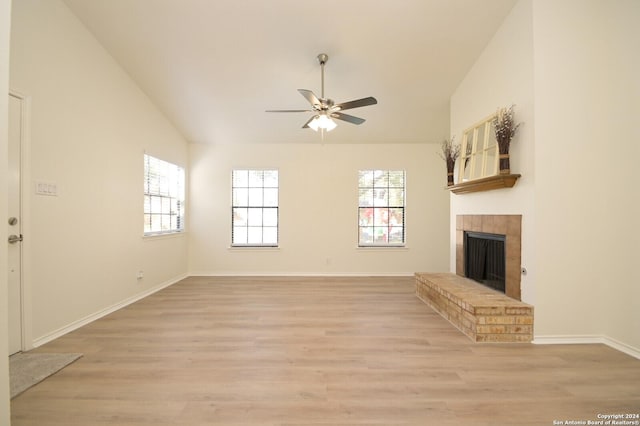 unfurnished living room with ceiling fan, light hardwood / wood-style flooring, and lofted ceiling