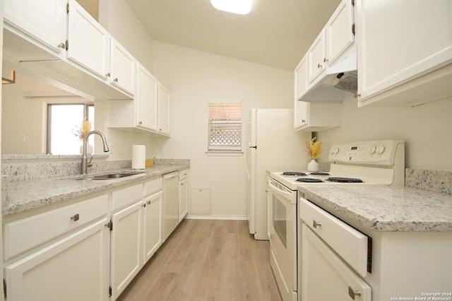 kitchen featuring sink, light stone counters, vaulted ceiling, white appliances, and white cabinets