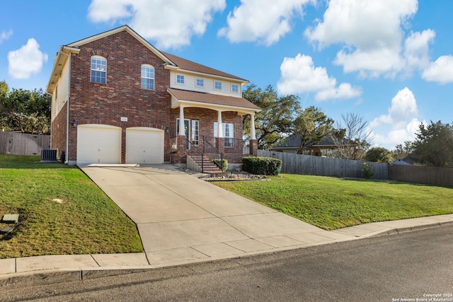 view of front of property with central air condition unit, a front lawn, and a garage