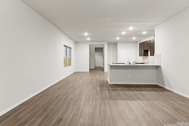 2659 Greenwell Ln, New Braunfels, TX 78130 - unfurnished living room with dark wood finished floors and recessed lighting