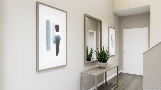 hallway with hardwood / wood-style floors