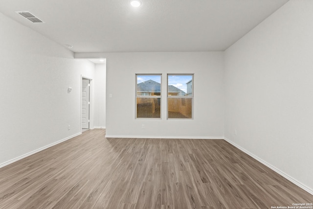 2659 Greenwell Ln, New Braunfels, TX 78130 - spare room featuring wood finished floors and recessed lighting