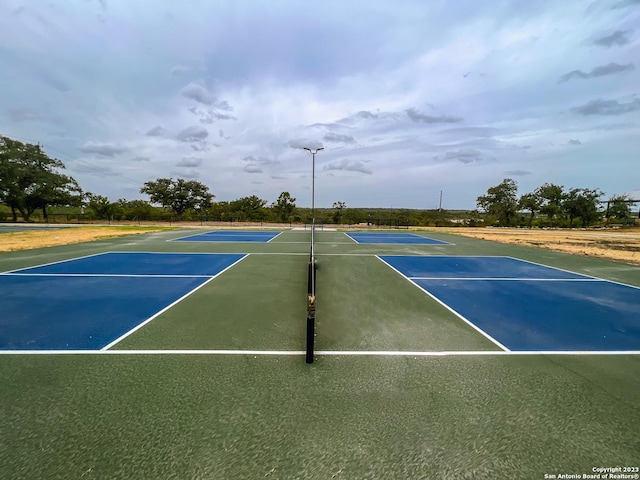 view of tennis court with basketball court