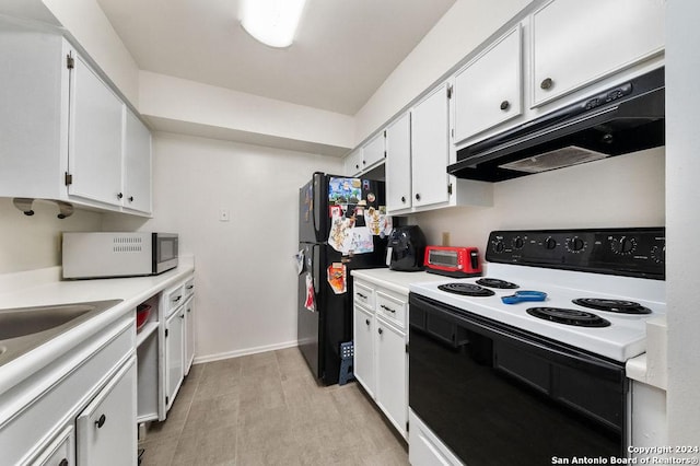 kitchen with black refrigerator, white electric range, light hardwood / wood-style floors, and white cabinetry