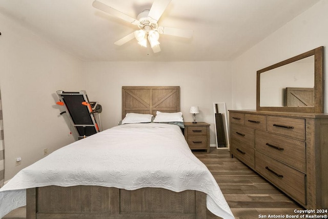 bedroom featuring ceiling fan and dark wood-type flooring