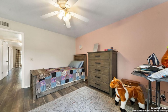 bedroom with ceiling fan and dark hardwood / wood-style floors