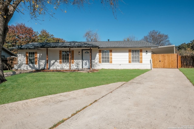 ranch-style house with a front yard