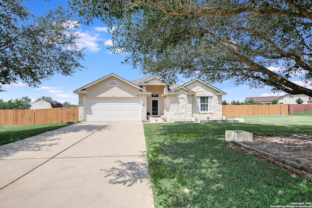 ranch-style home with a front yard and a garage