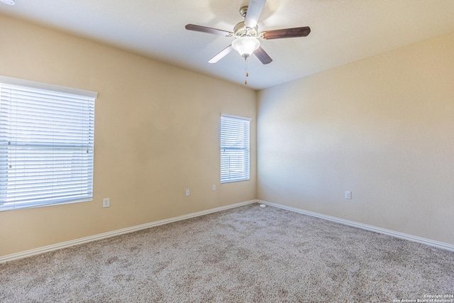 empty room with light carpet and ceiling fan