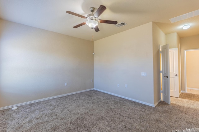 spare room with carpet flooring and ceiling fan