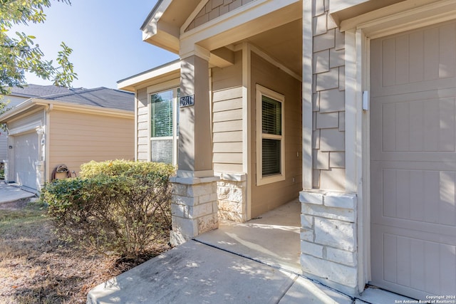 property entrance with a garage