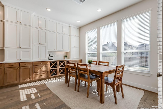 dining area featuring light hardwood / wood-style flooring and plenty of natural light