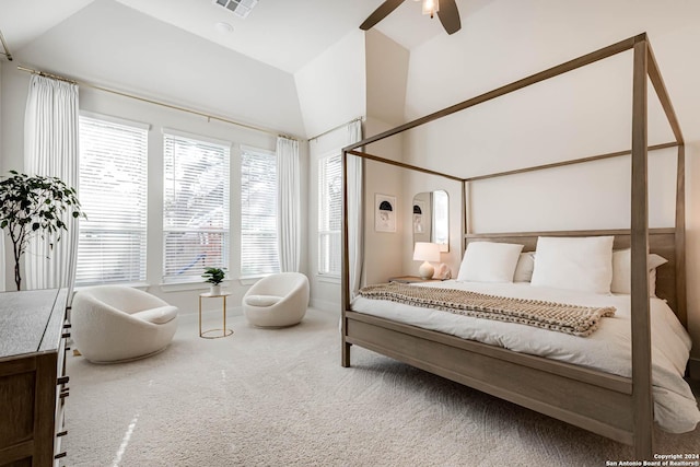 carpeted bedroom with ceiling fan and lofted ceiling