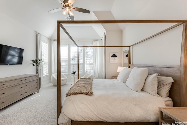 carpeted bedroom with ceiling fan and lofted ceiling