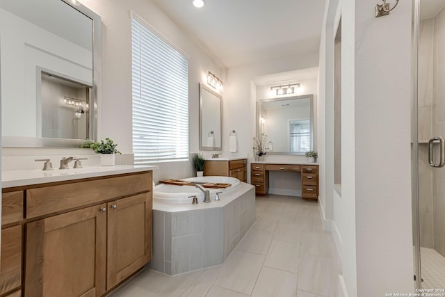 bathroom with tile patterned floors, vanity, and independent shower and bath