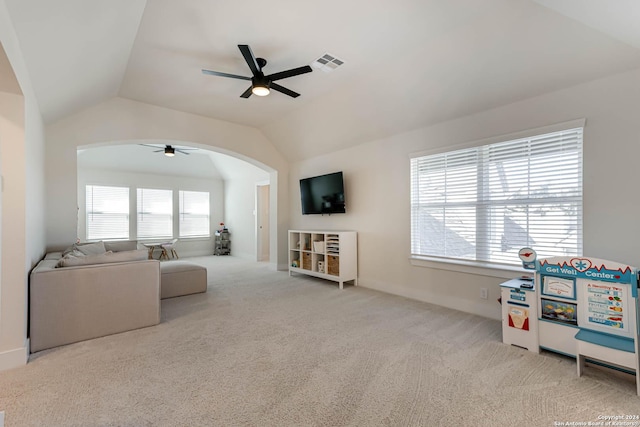 living room with light carpet, ceiling fan, and lofted ceiling