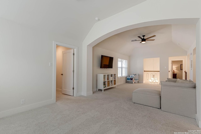 carpeted living room featuring ceiling fan and lofted ceiling