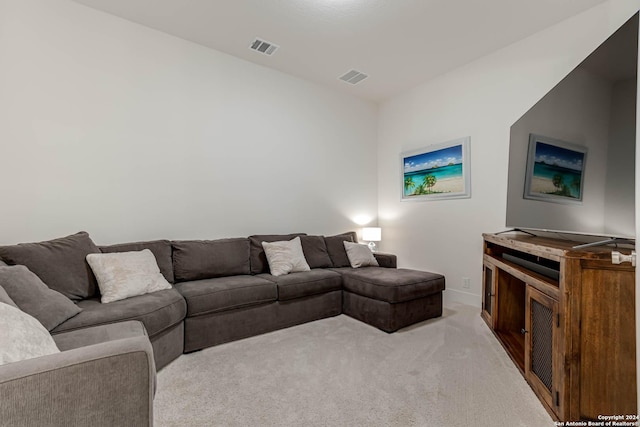 living room featuring light carpet