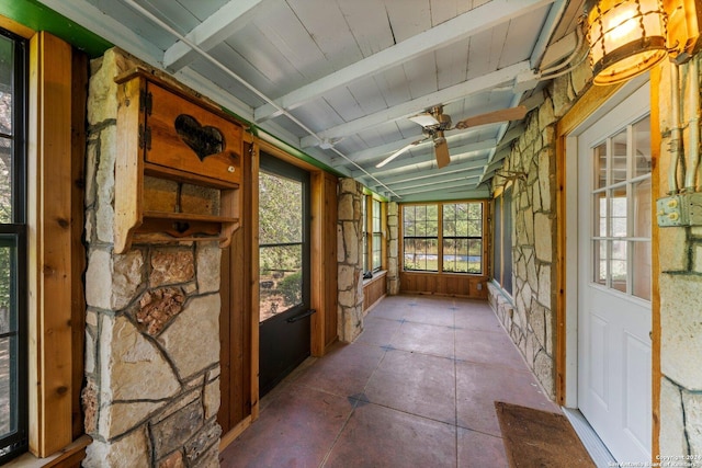 unfurnished sunroom with lofted ceiling with beams and ceiling fan