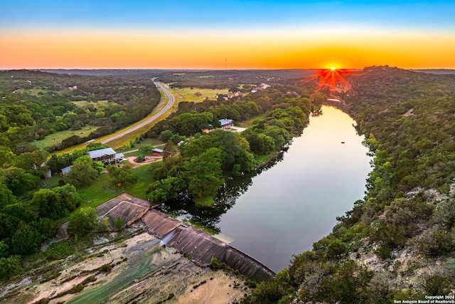 aerial view at dusk with a water view