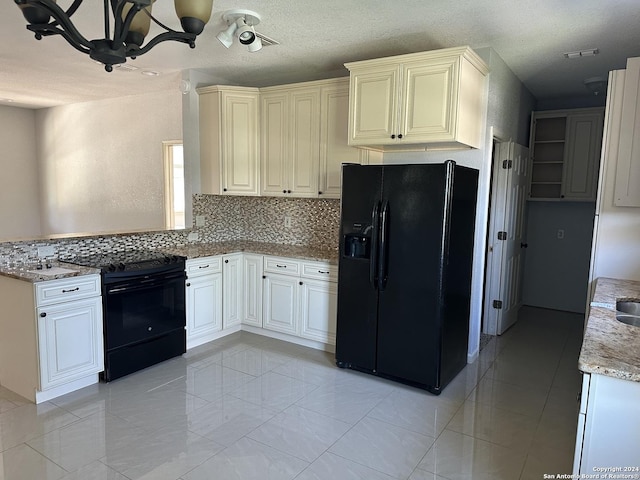 kitchen featuring light stone countertops, tasteful backsplash, a textured ceiling, black appliances, and a chandelier