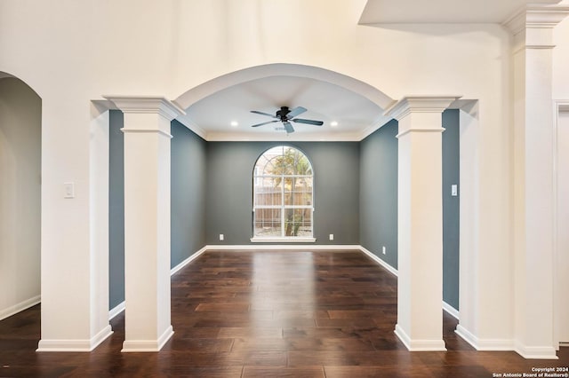 spare room with ceiling fan, dark wood-type flooring, and ornamental molding