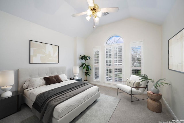 bedroom featuring ceiling fan, light colored carpet, and vaulted ceiling