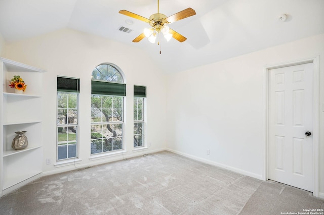 unfurnished room with light carpet, ceiling fan, and lofted ceiling