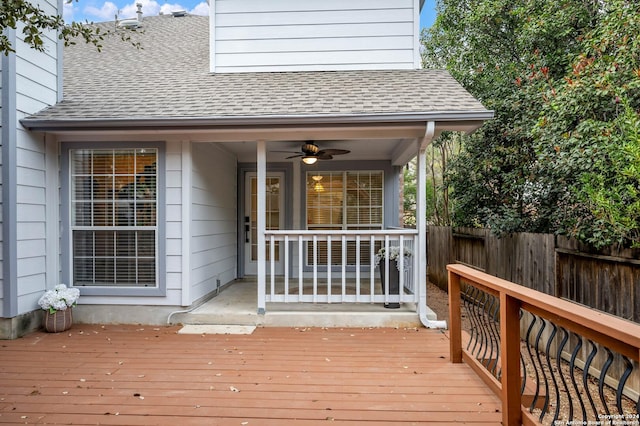 wooden deck featuring ceiling fan