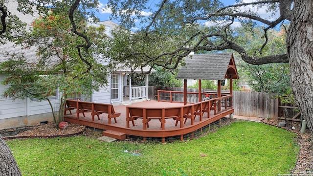 wooden terrace with a lawn