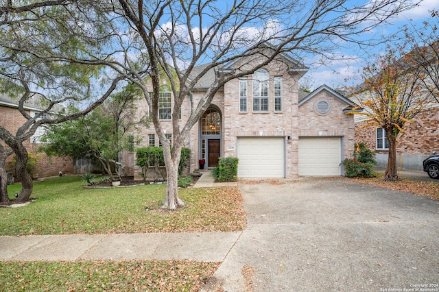 view of front of house featuring a garage and a front yard