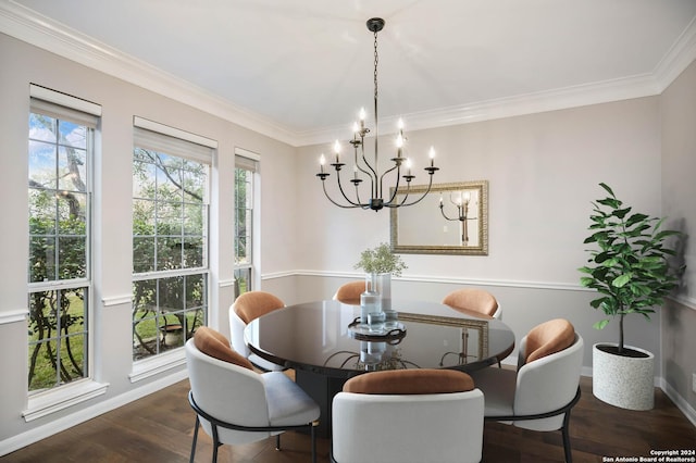 dining room featuring a notable chandelier, dark hardwood / wood-style flooring, and ornamental molding