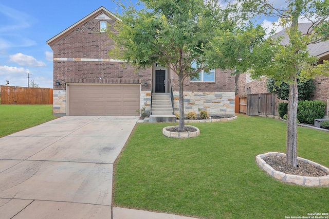 view of front of home featuring a front lawn and a garage