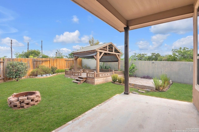 view of yard featuring a gazebo, a patio, and a fire pit