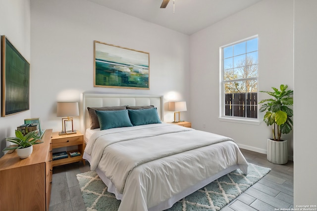 bedroom with light wood-type flooring and ceiling fan