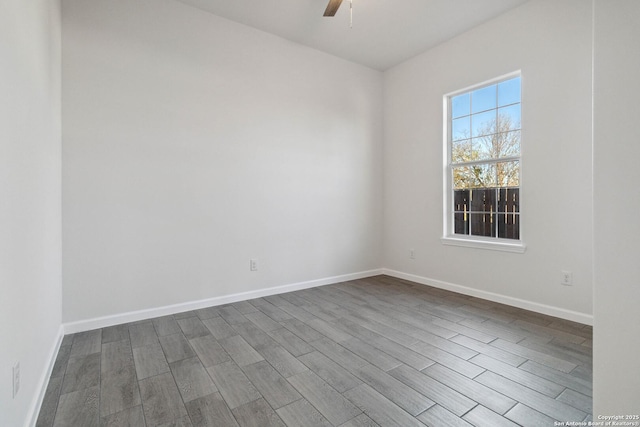 unfurnished room featuring hardwood / wood-style floors and ceiling fan