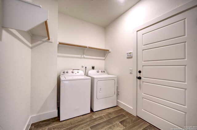 clothes washing area featuring washer and dryer