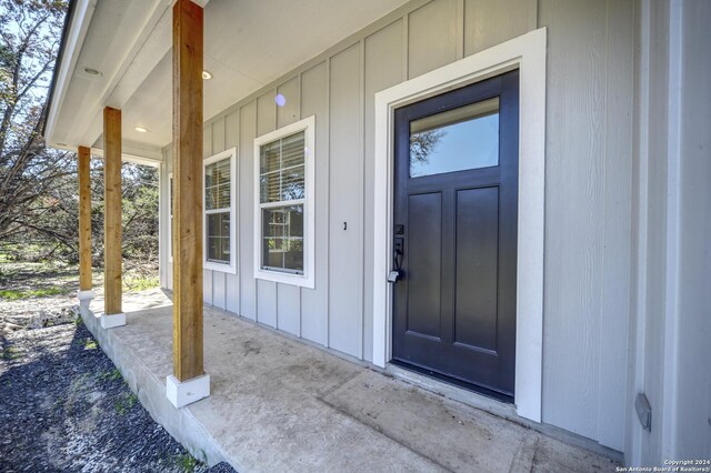 property entrance with covered porch