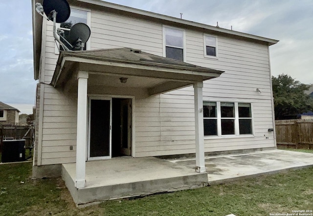 back of property featuring a patio and central AC