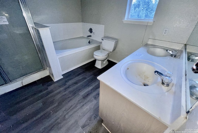 full bathroom featuring hardwood / wood-style flooring, vanity, separate shower and tub, and toilet