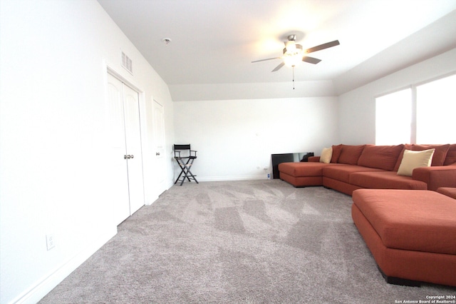 carpeted living room with ceiling fan