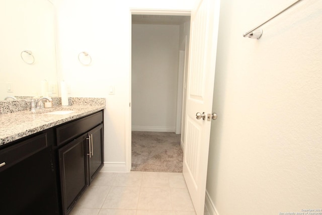 bathroom featuring tile patterned flooring and vanity